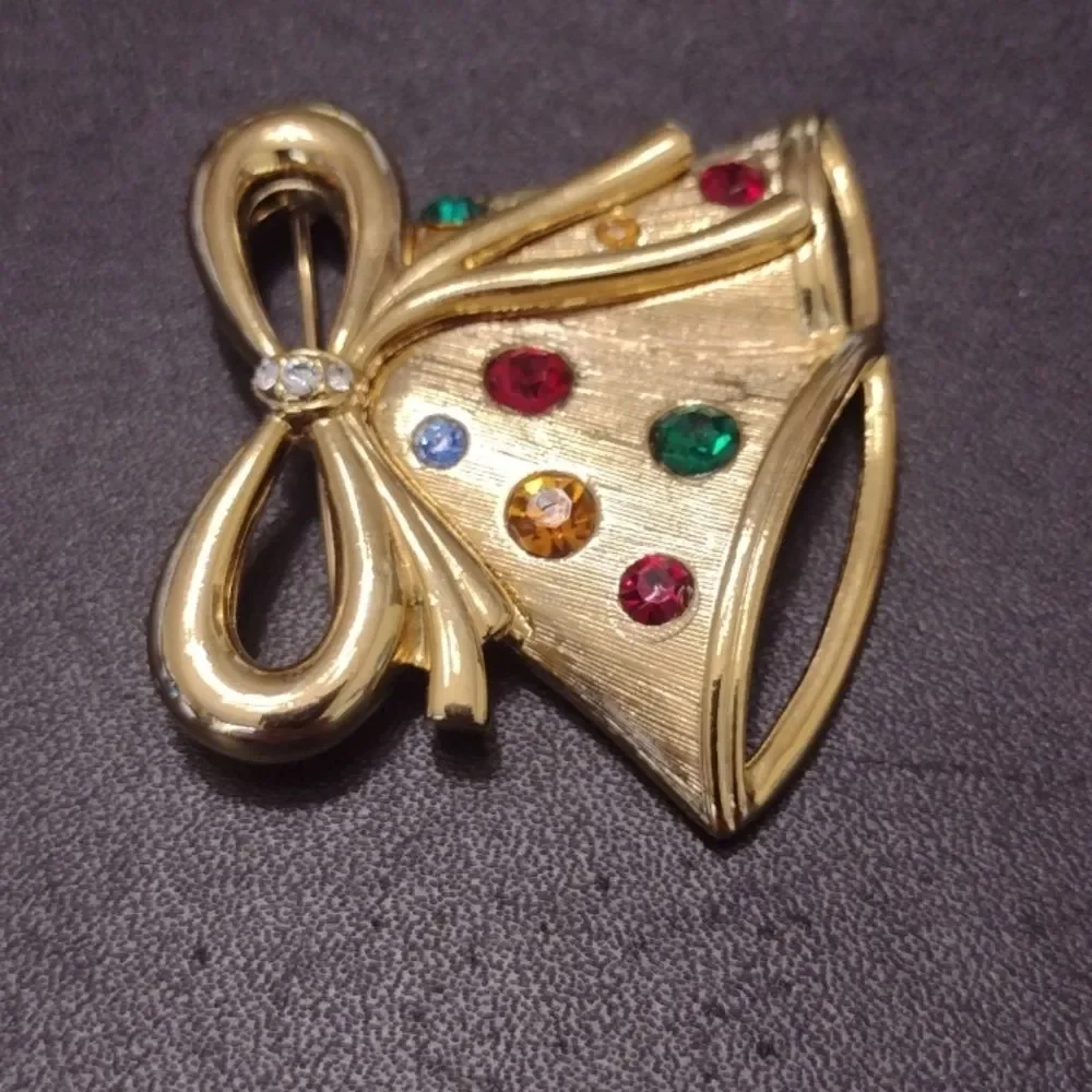 Vintage gold tone bell brooch